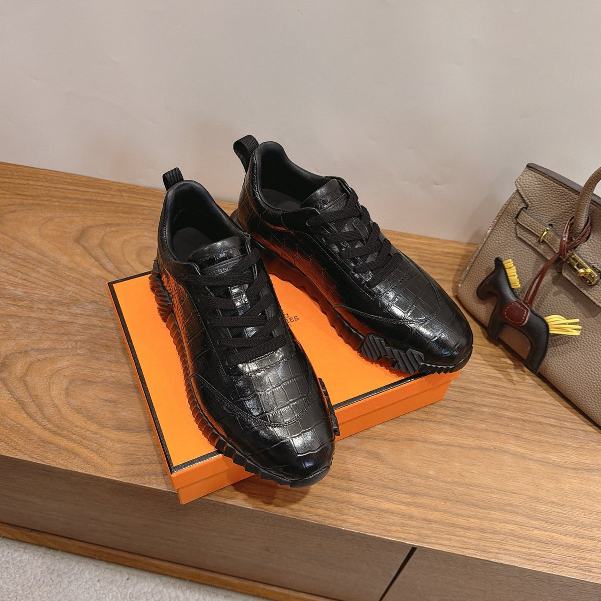 Hermès Black Textured Low-Top Sneakers — side