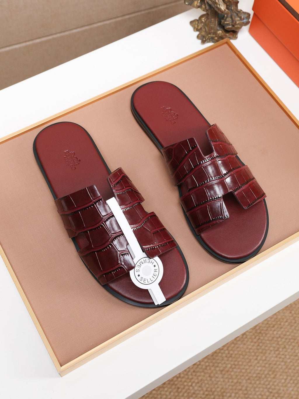 Hermès Burgundy Textured H Slide Sandals — front