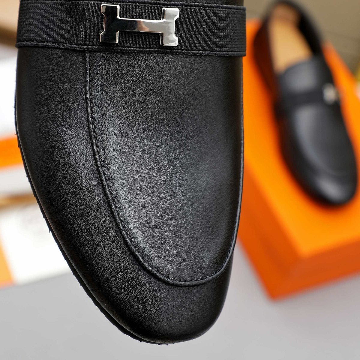 Hermès Black H-Hardware Slip-On Loafers — detail