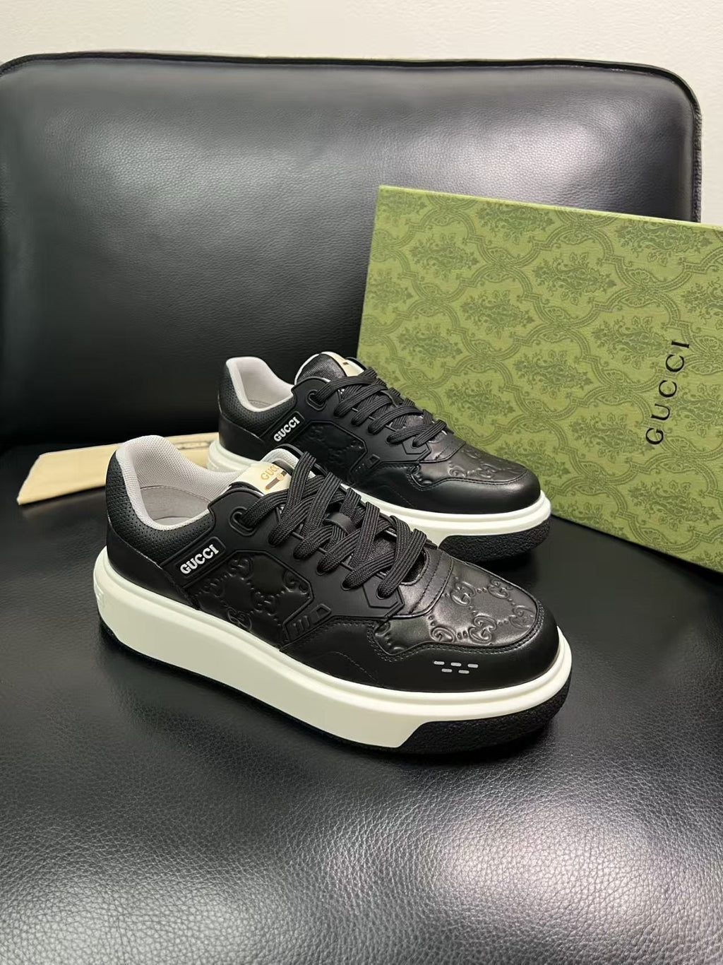 Gucci Embossed Low-Top Sneakers — hero