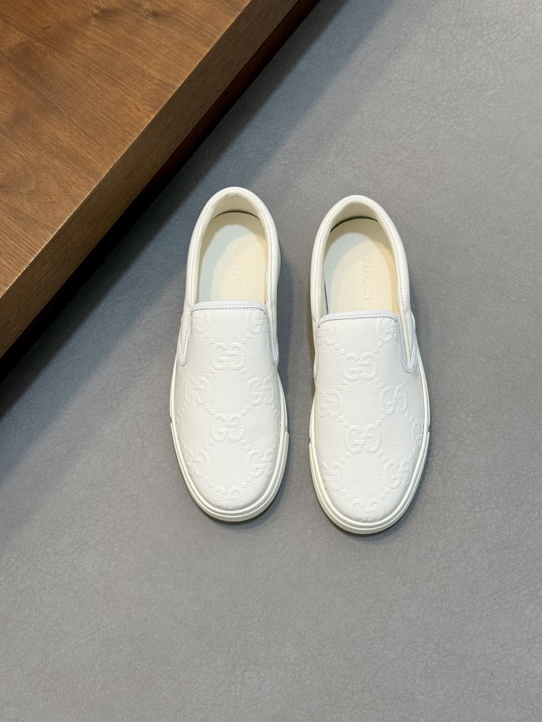 Gucci Embossed Slip-On Sneakers — front